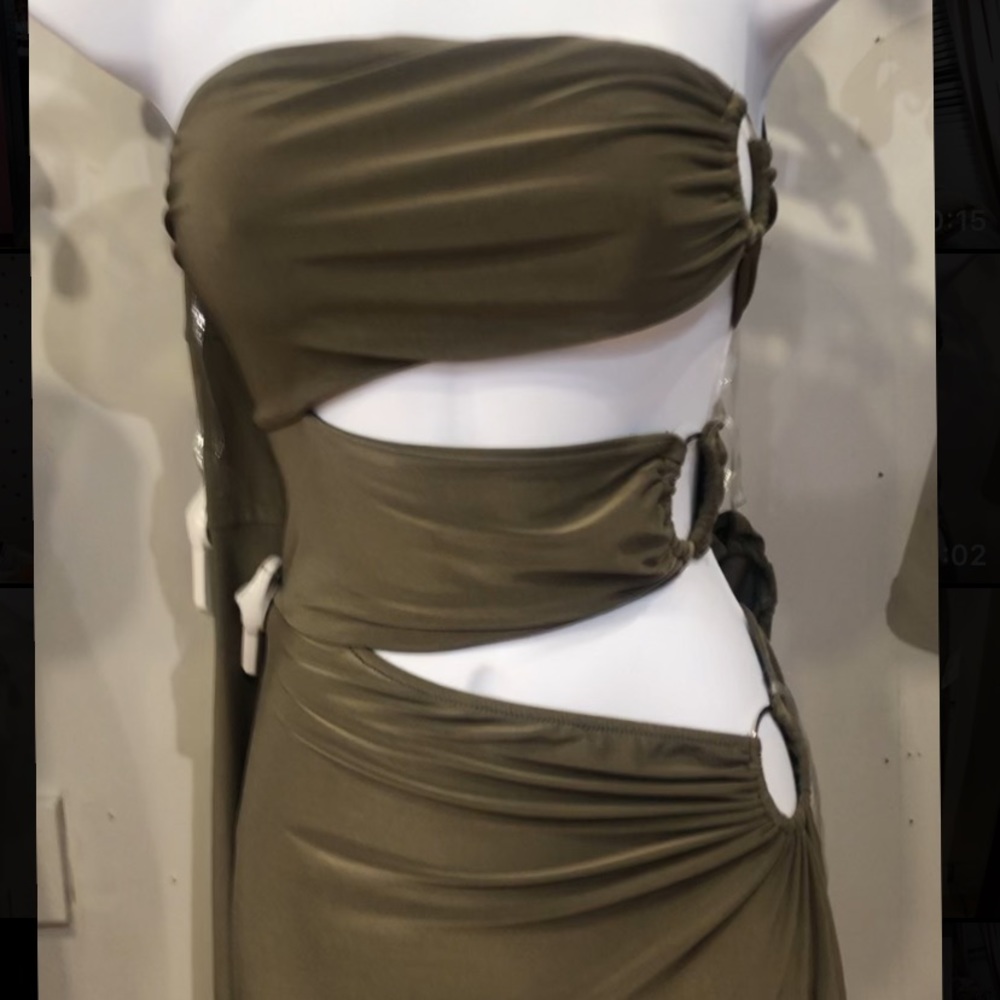 Olive green long dress. 3 slits showing back. One high leg slit worn once